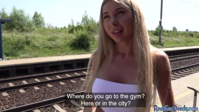 Lovely blonde nailed outdoor at the train station