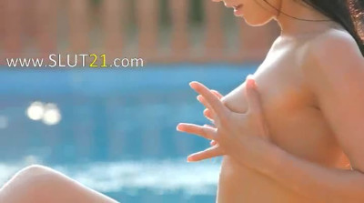 Naughty Paloma pleasuring herself by the pool 