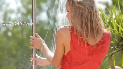 Yummy teen splashing her body and teasing outdoors 