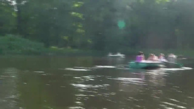 Sweet brunette ecposing on a lake