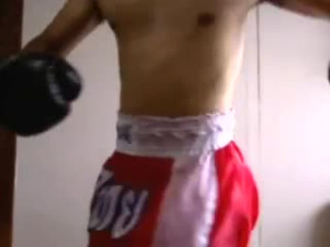 Muay Thai fighter jacking with his gloves